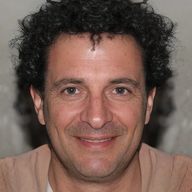 Smiling man with curly hair